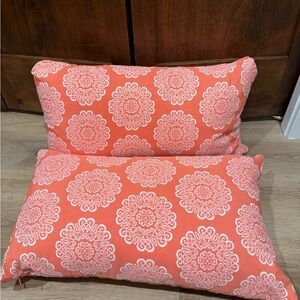 Coral and White Patterned Pillows